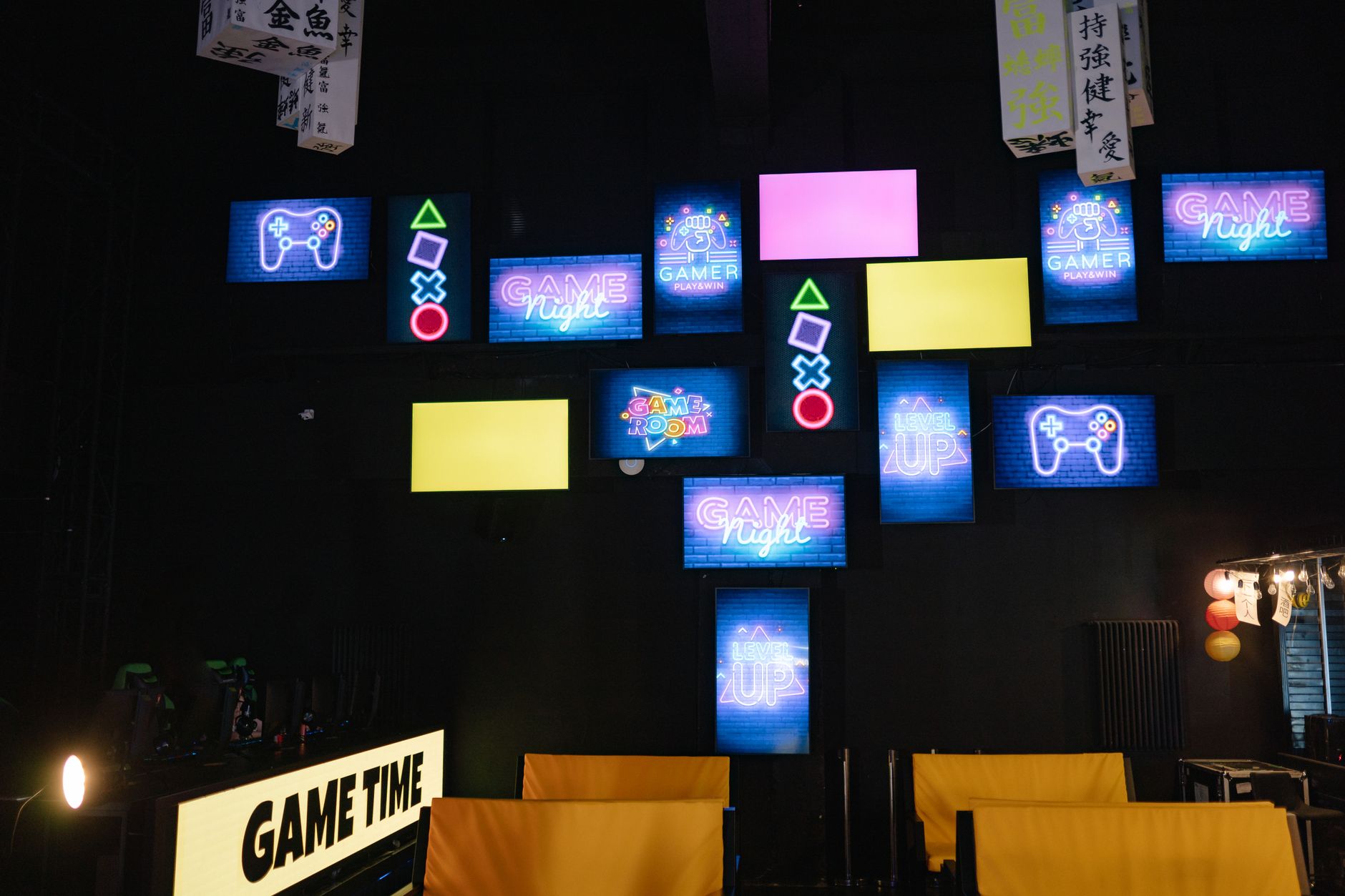 Gaming setups with neon lights and consoles